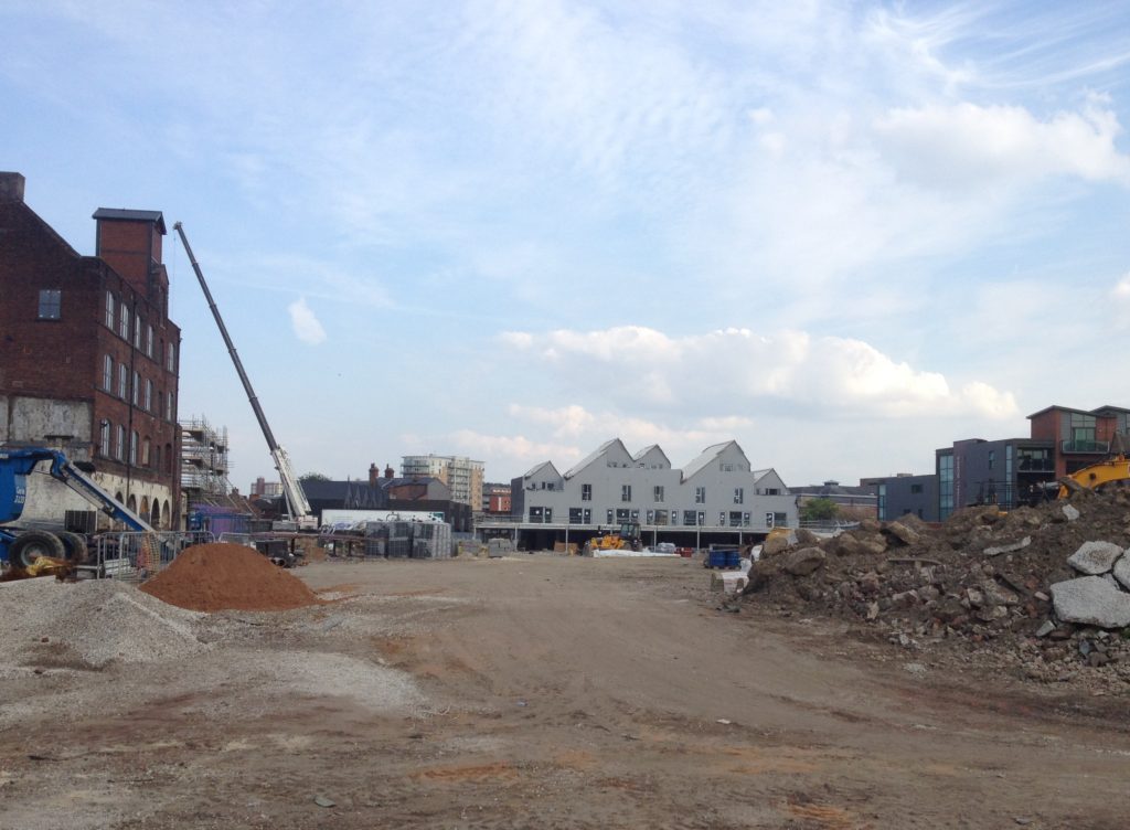 As taken from Green Lane end, phase 1b is visible in the distance with the pitched roofs.